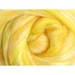 Close up of brilliant yellow fibre with touches of white silk
