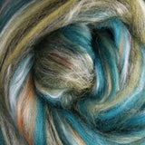 Close-up of multicolored fibre with shades of blue, green, and brown.