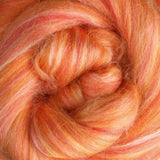 Close-up of a skein of orange and pink fibre