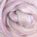 Close-up of pastel pink, yellow and green fibre blended with white silk