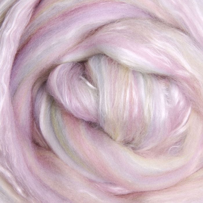 Close-up of pastel pink, yellow and green fibre blended with white silk