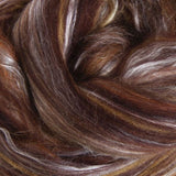 Close-up of chocolate brown fibre blended with lighter tones and grey
